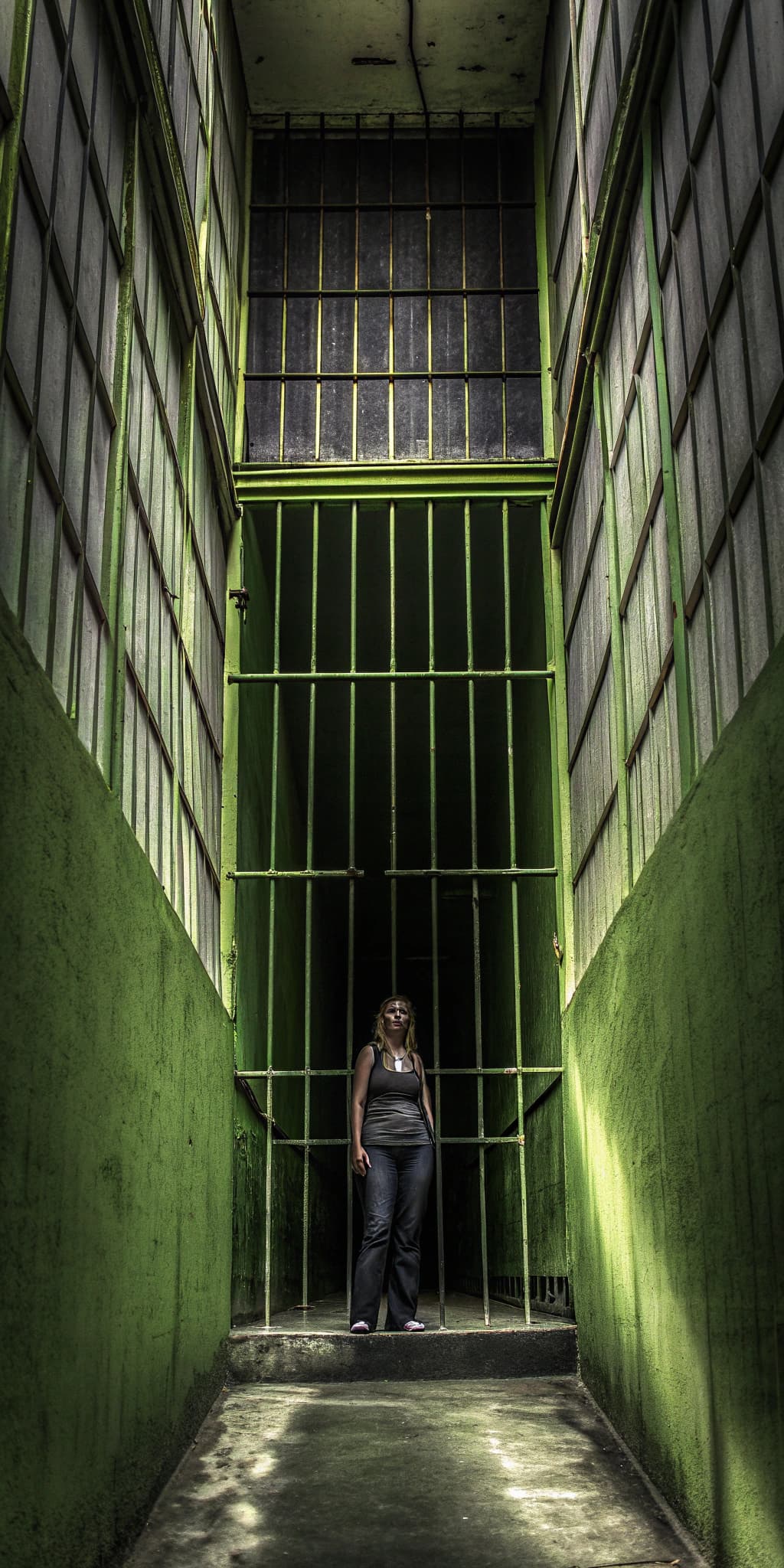 AI generated: Full body view,Escher-style haunted prison  on woman upper body,optical illusion, impossible geometr...