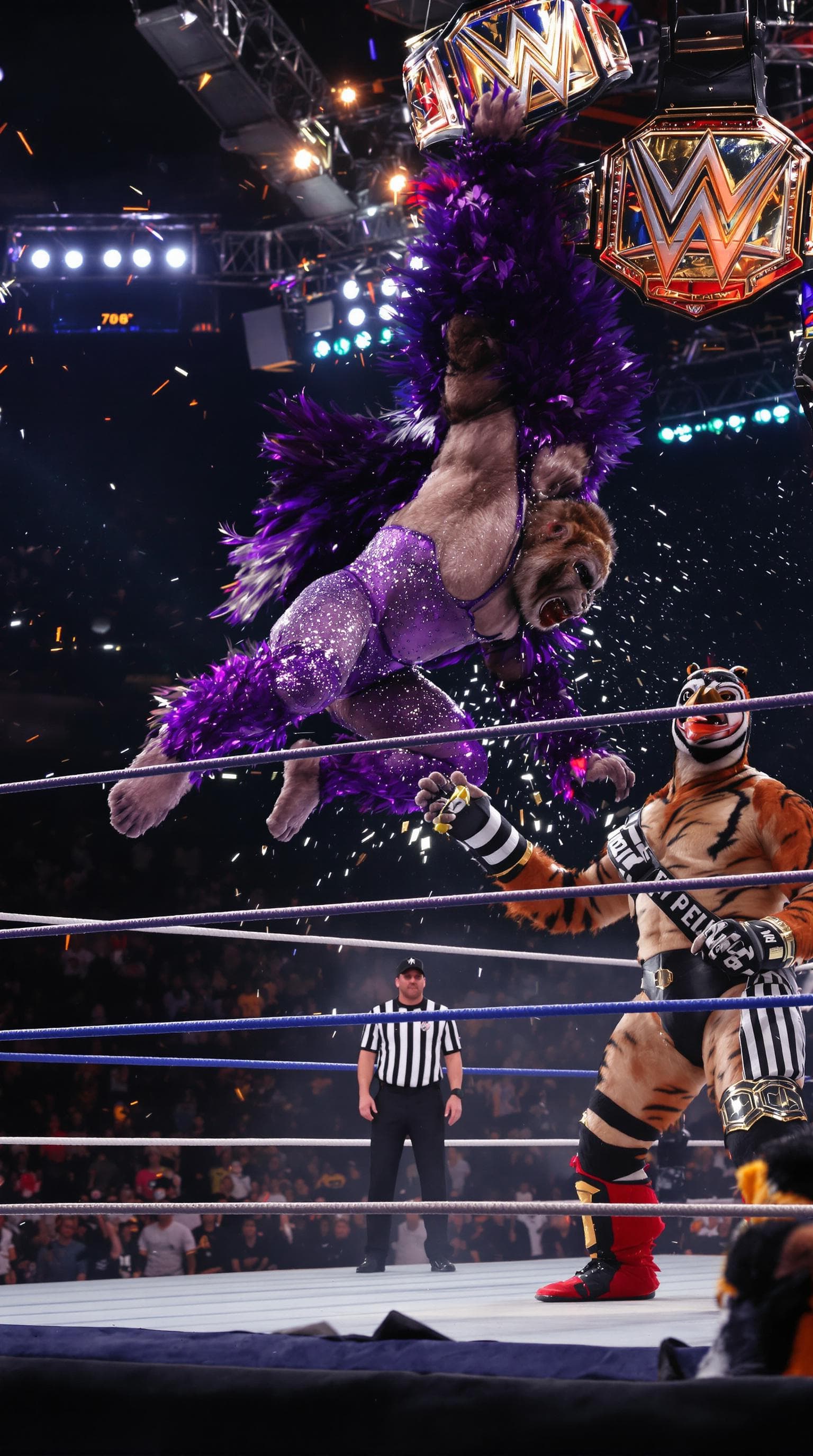 AI generated: A WWE-style wrestling scene with a gorilla in sparkly purple wrestling tights and feathered cape, pe...