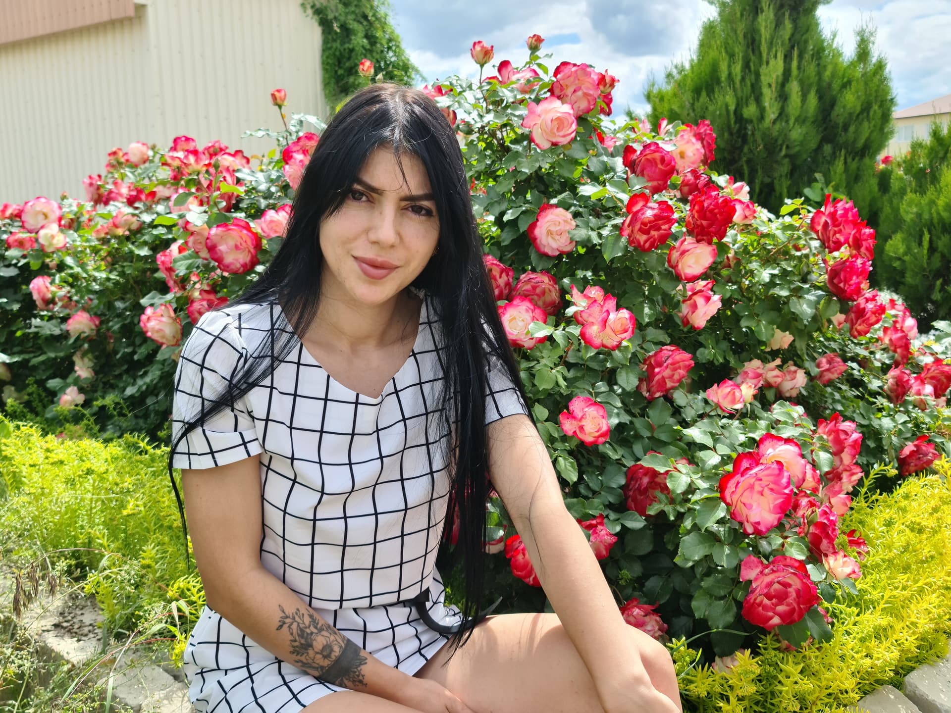 AI generated: Extremely detailed close-up photograph of a woman sitting in front of a rose bush, her eyes glowing ...