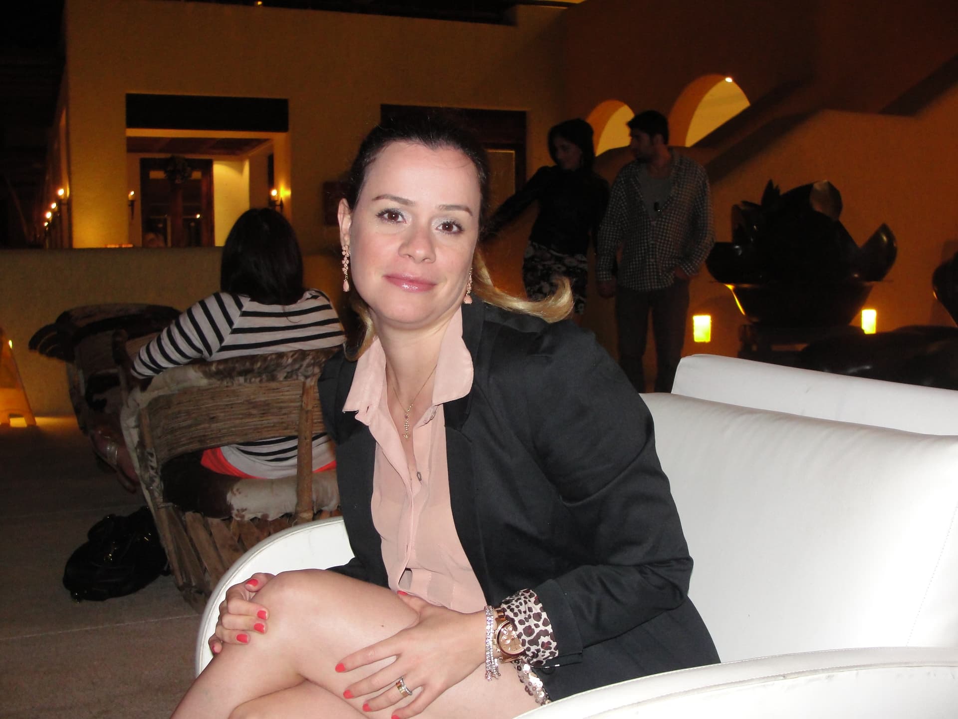 AI generated: A fashion model relaxing at the sofa