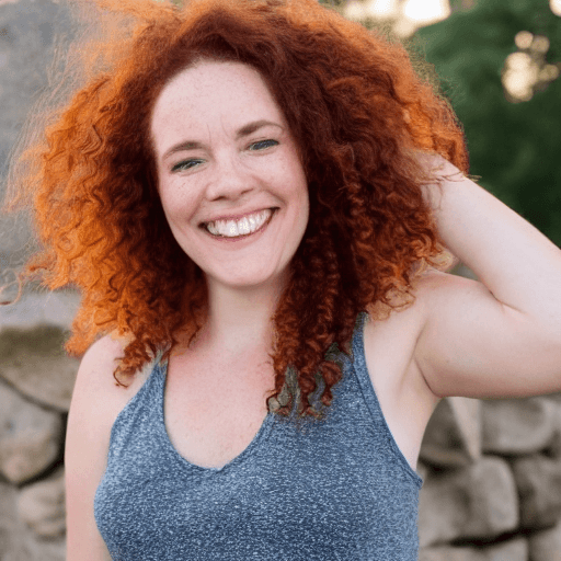AI generated: breathtaking woman, spiral curls, long auburn hair, (freckles:0.6), standing in a stone walkway in a...