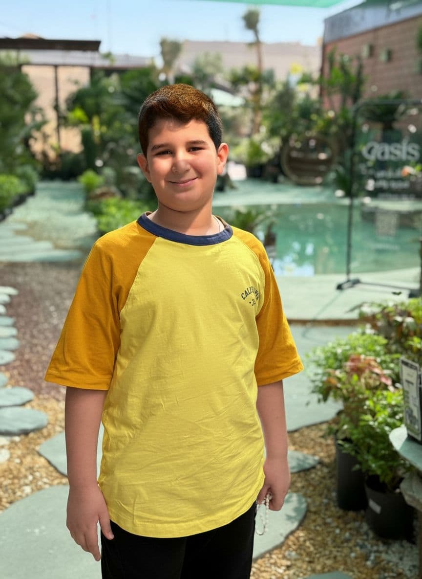 AI generated: a boy with curly hair and yellow shirt, in the style of rendered in cinema4d, charming characters, i...