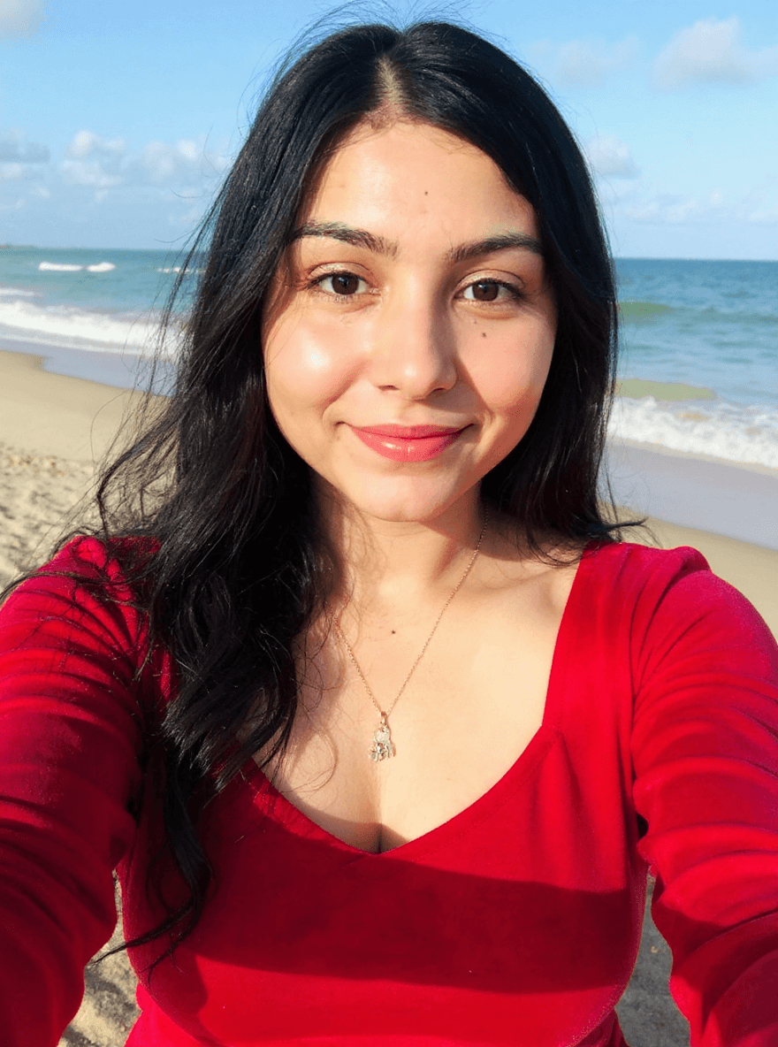 AI generated: make the upload person to wear bikibi and she is on the beach make realistic

