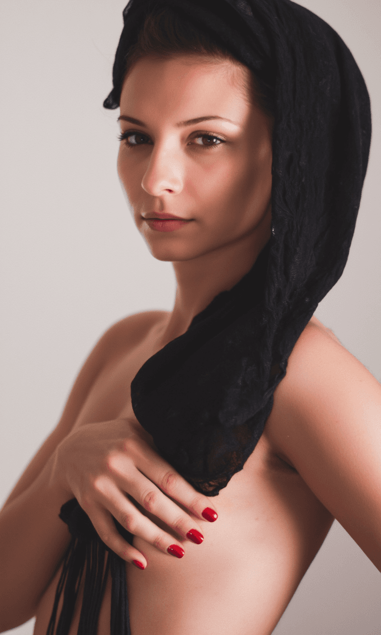 AI generated: A fine art portrait of a woman with a calm, confident expression, gazing softly into the distance. S...