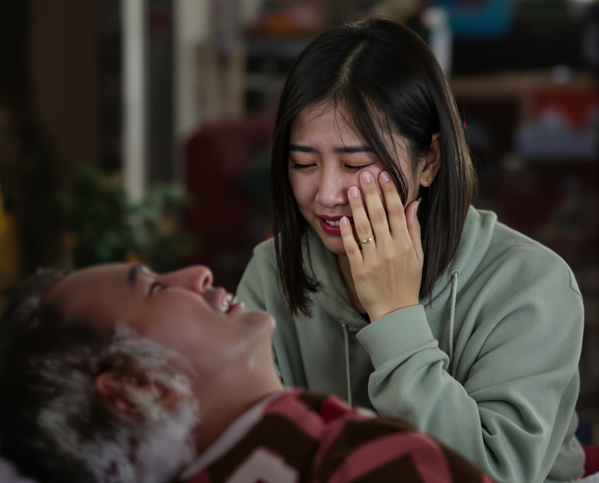 AI generated: A young Asian woman is crying over her deceased father.