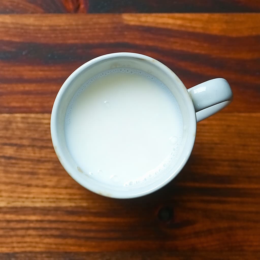 AI generated: a mug of thick creamy milk