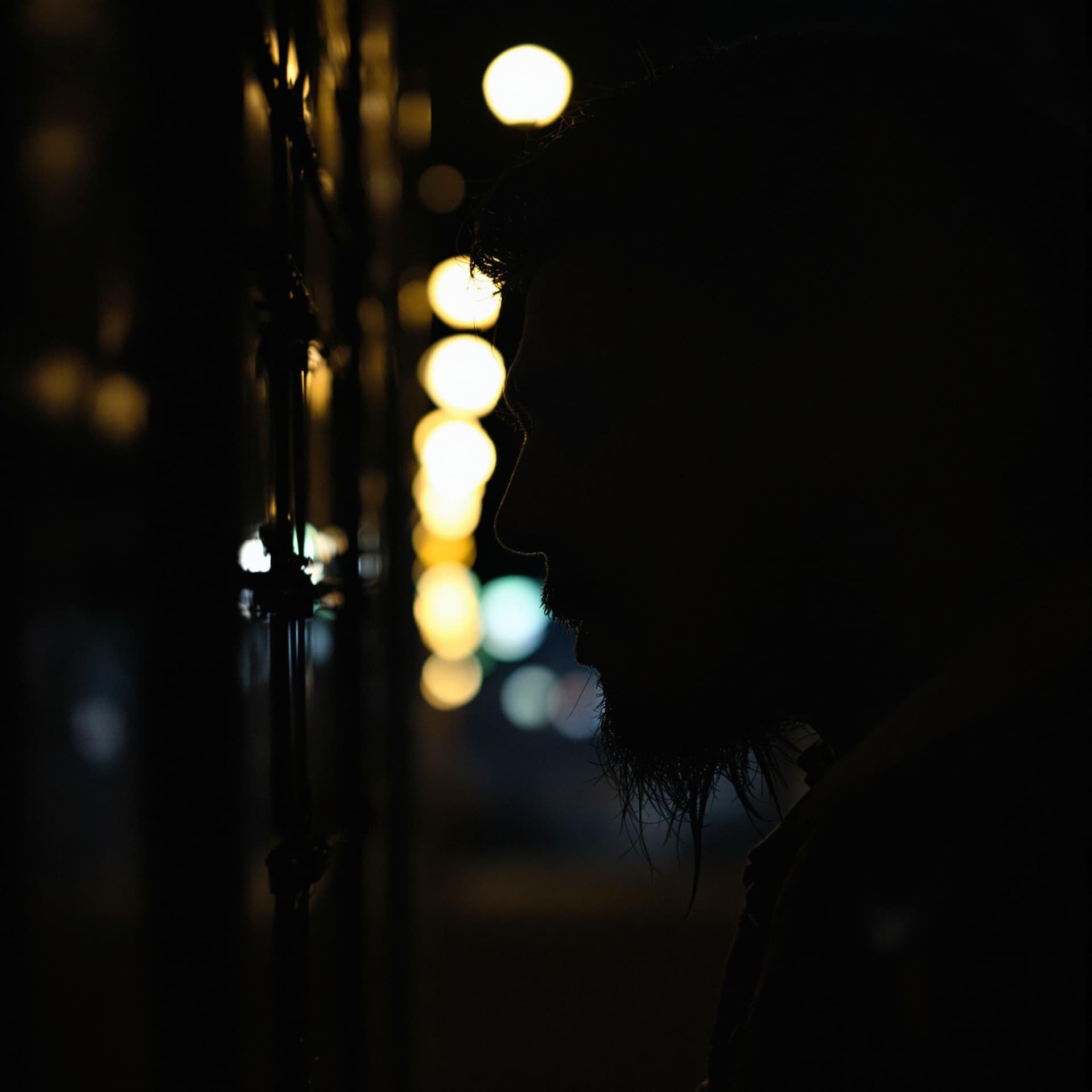 AI generated: cinematic photography, Aswang emerging from shadows, late evening light, long exposure shot, lights ...