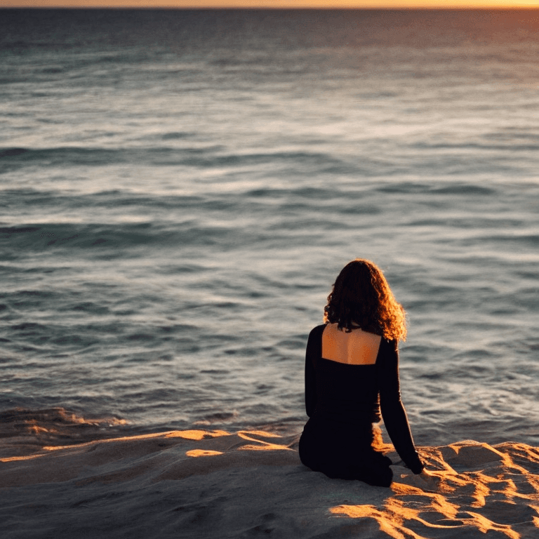AI generated: Lovely brown eyed woman walking by the sea at sunset. wearing (black clothes).  photographic, realis...