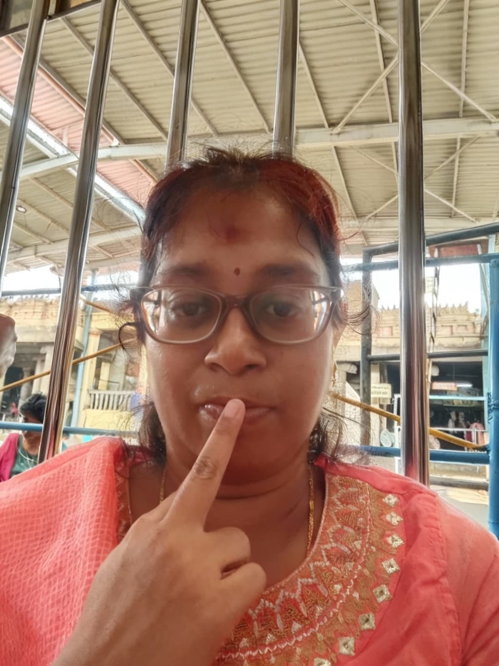AI generated: put her middle finger on mouth.