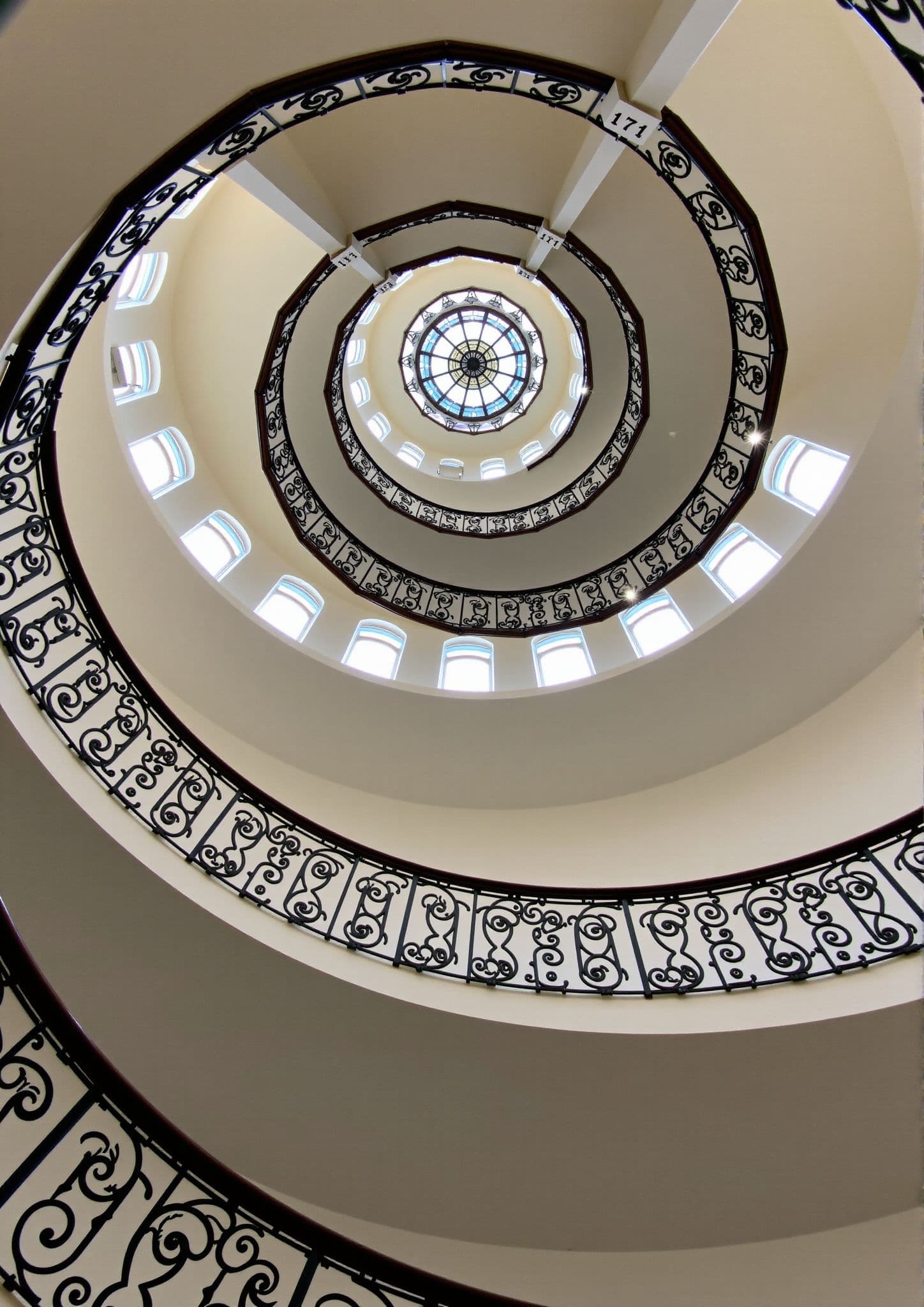 AI generated: The interior view looking directly up a magnificent spiral staircase. <lora:UltraRealPhoto:1>