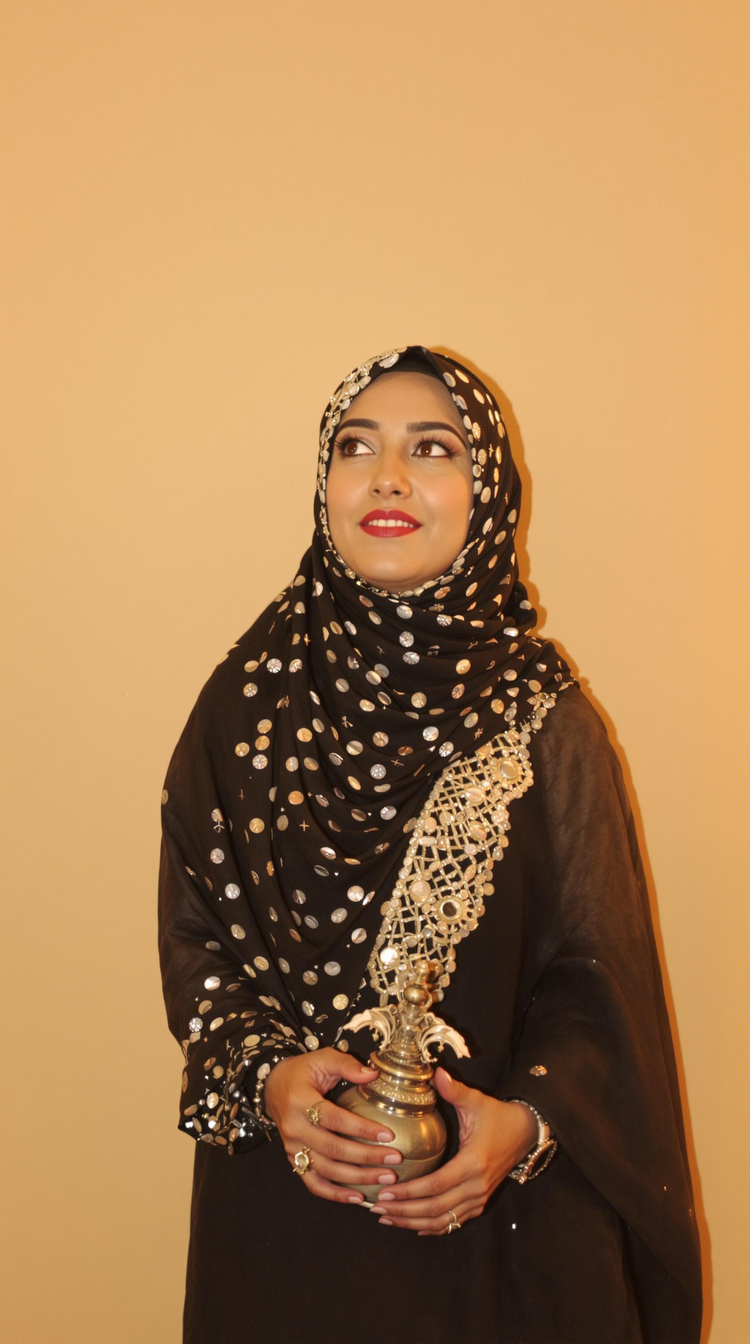 AI generated:  Arab woman 30 posing against a warm beige backdrop.
