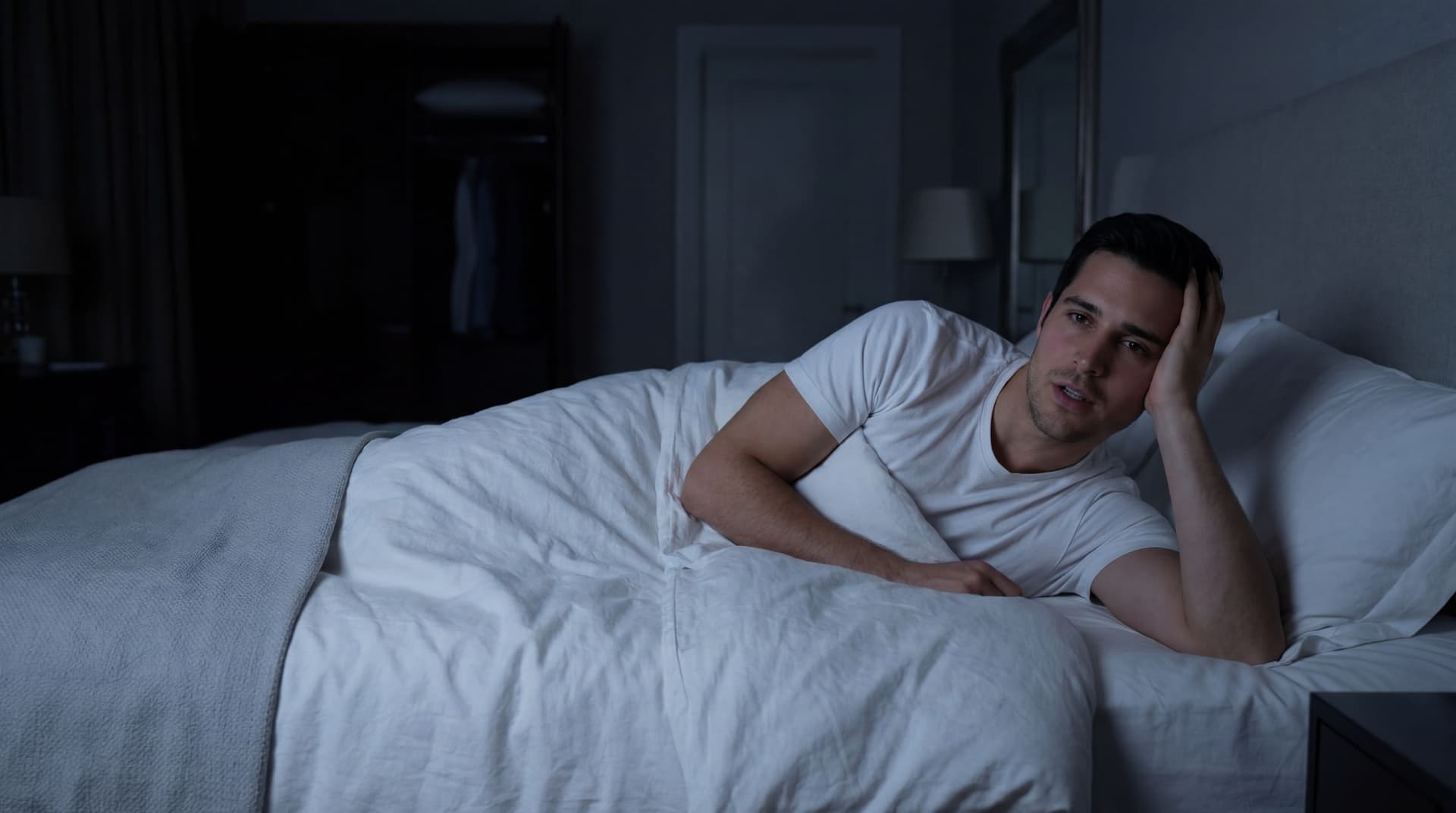 AI generated: At a very nice large bedroom at night. there are no windows. The lights are OFF. the Hispanic guy ha...