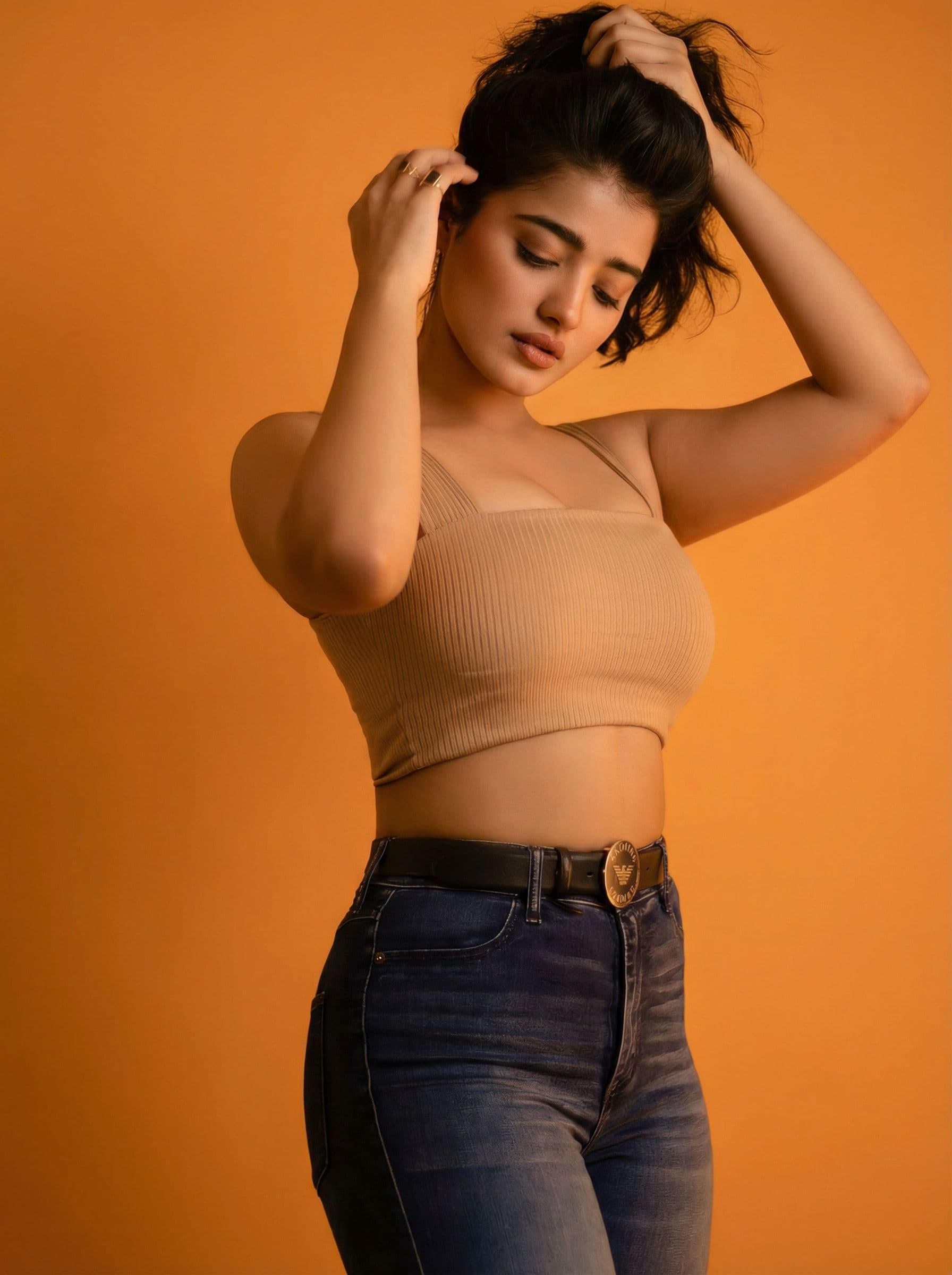 AI generated: photography, orange hue, model, solid orange backdrop, using a camera setup that mimics a large aper...