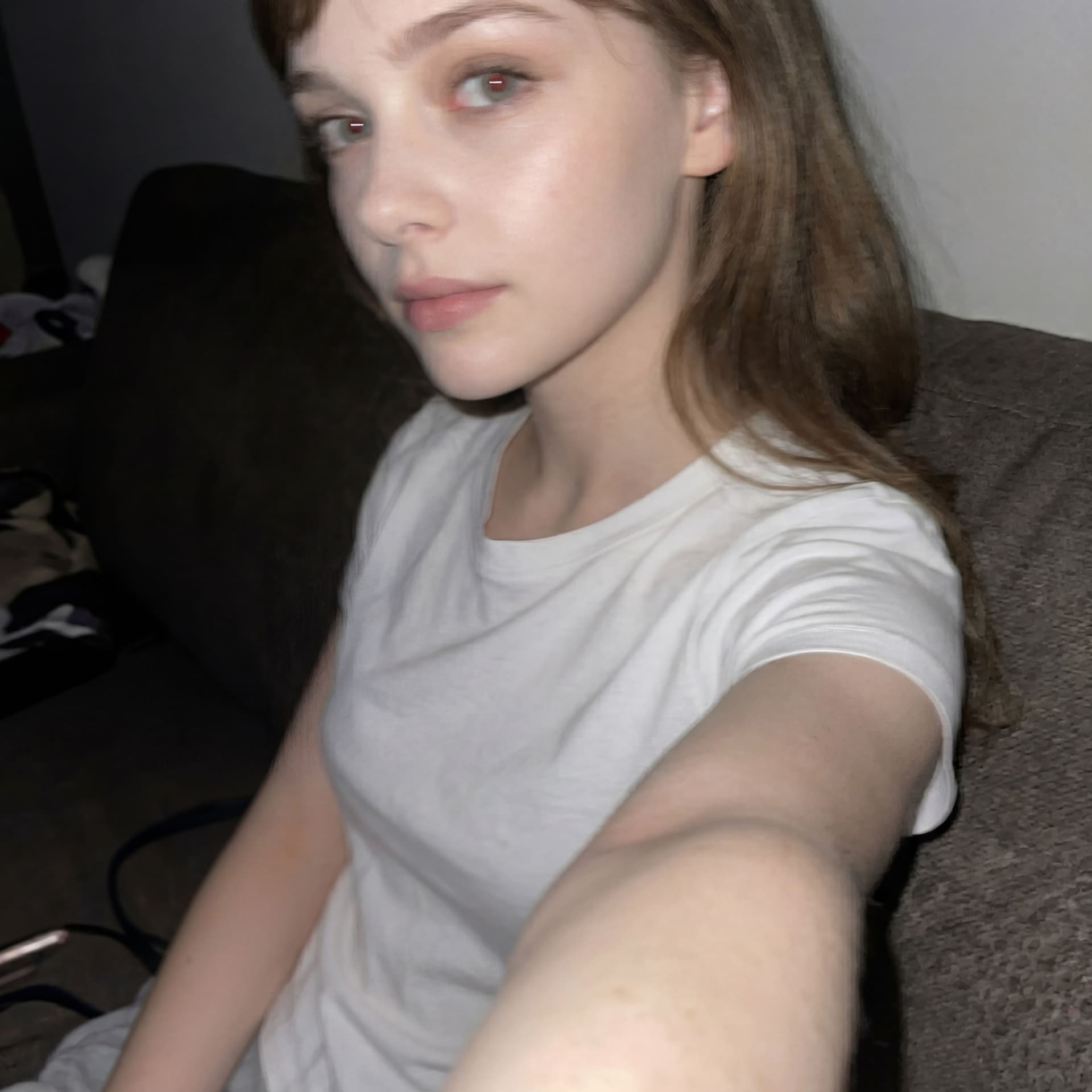 AI generated: Using the uploaded reference photo, create a standard iPhone selfie with flash. There's no clear sub...