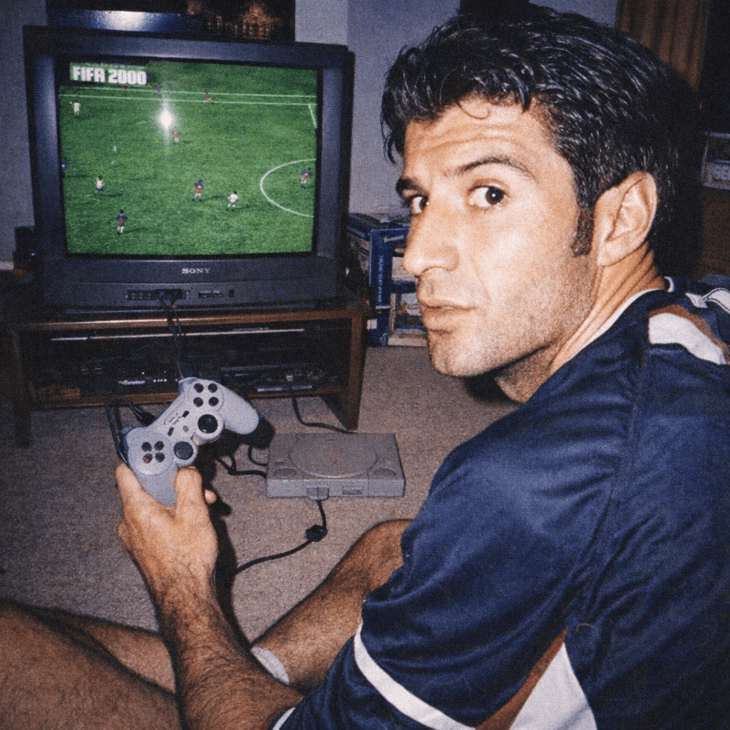 AI generated: Grungy analog photo of Luis Figo circa 2000 playing Fifa 2000 on Playstation 1 on a 90s CRT TV in a ...