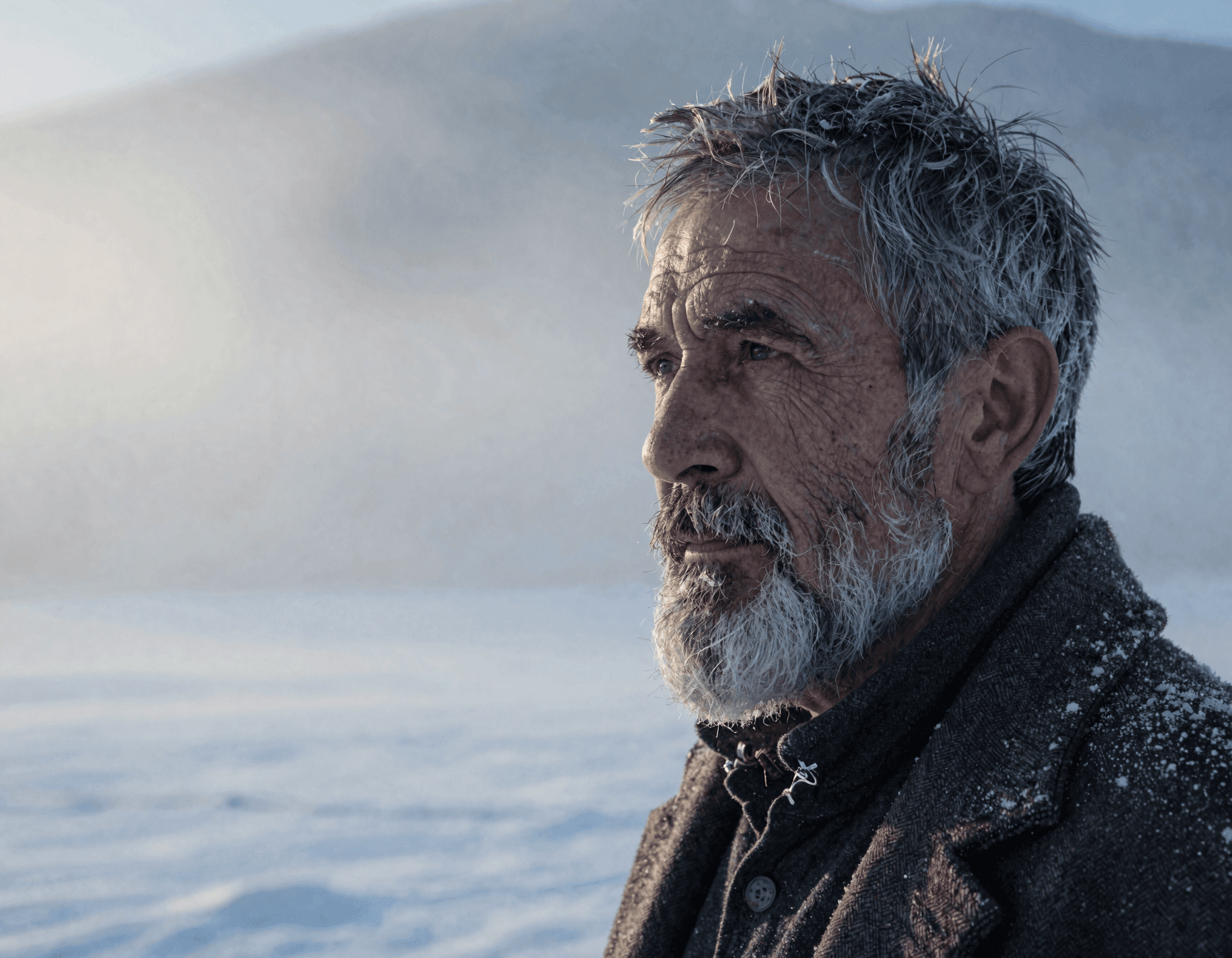 AI generated: A weathered man with deep-set eyes and a rugged beard flecked with gray, wearing a simple white wool...