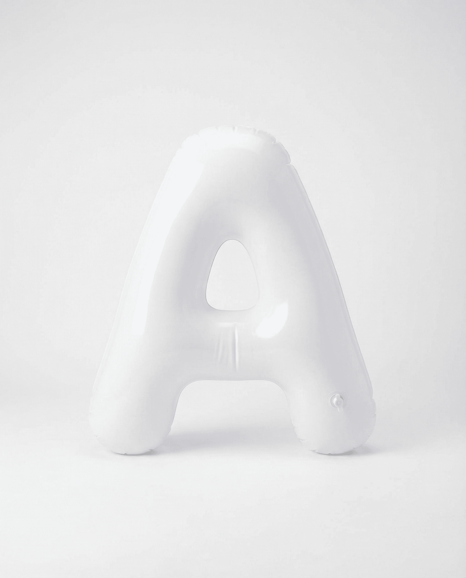 AI generated: PHOTOREALISTIC PRODUCT PHOTO, ultra-minimal white-on-white. A single inflated capital letter “A” mad...