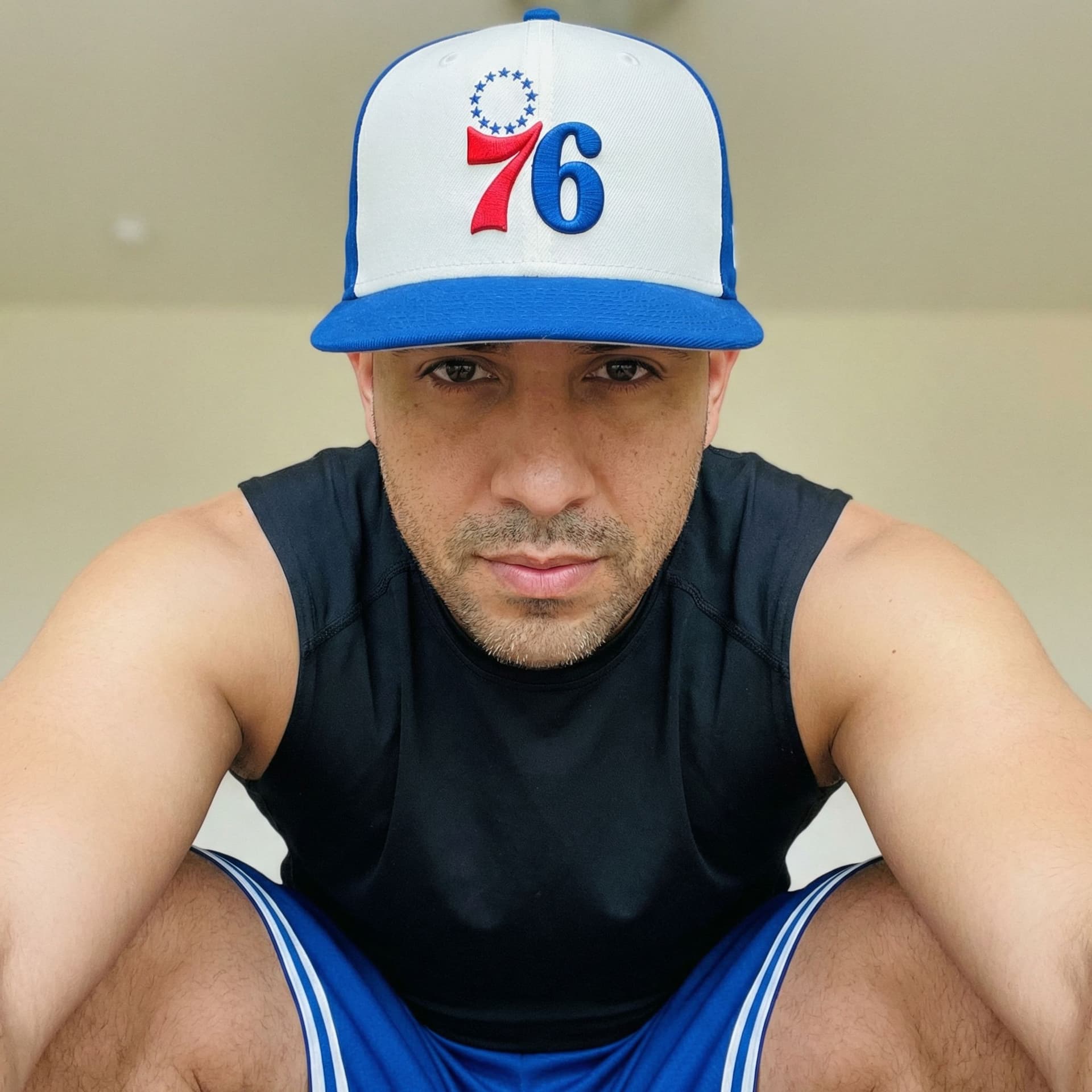 AI generated: The image is a close-up, low-angle shot of a man wearing a New Era fitted baseball cap, specifically...