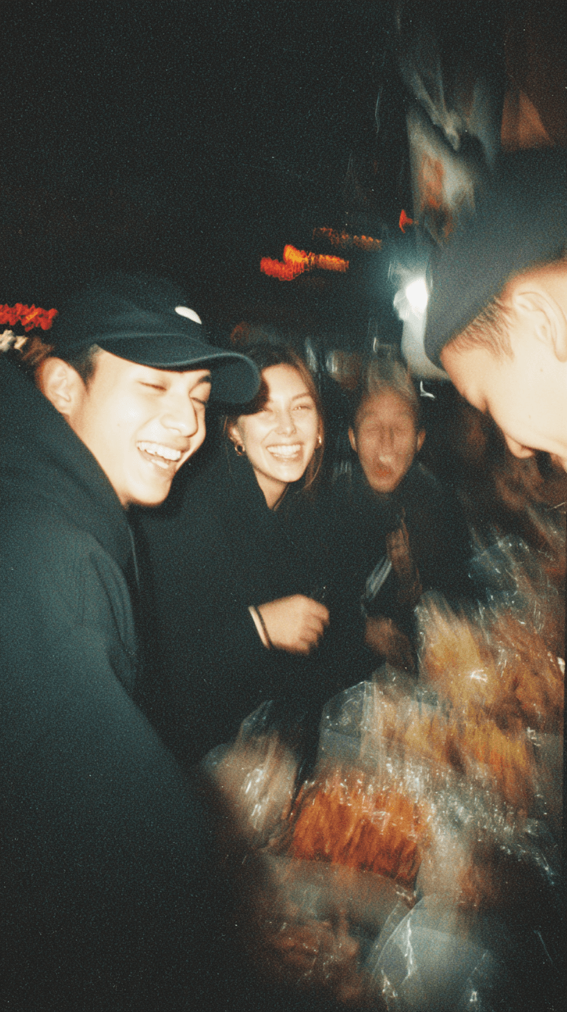 AI generated: flash photography, night street snap, disposable camera style, group of friends laughing at a street...