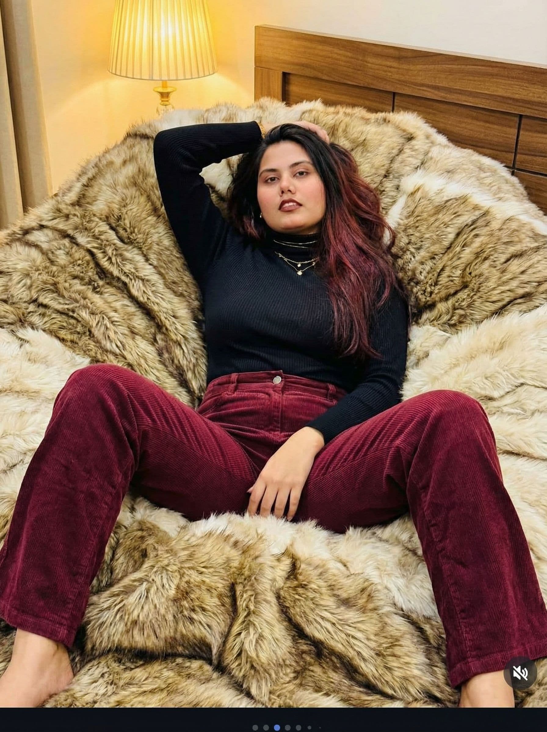 AI generated: woman laying on fur bed with legs spread apart, one hand behind her head the other down between her ...