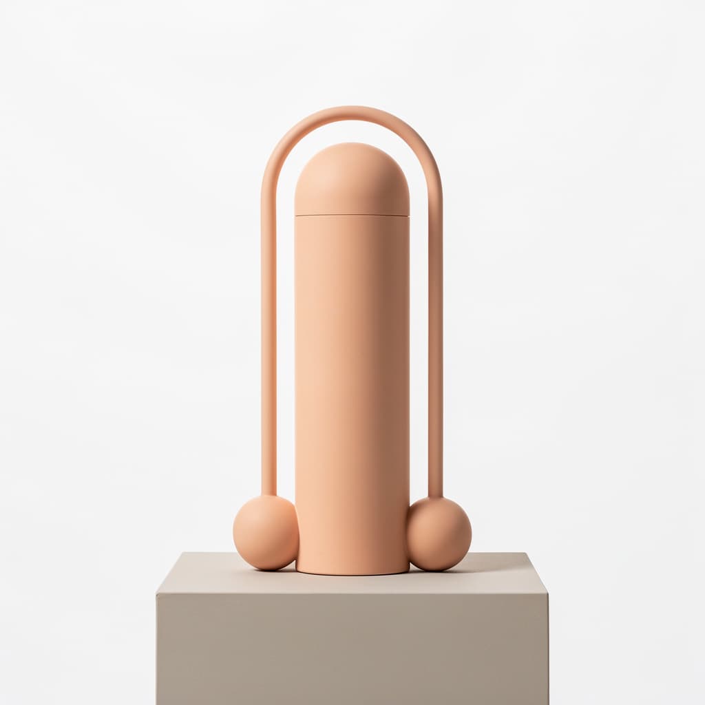 AI generated: Caucasian flesh colored phallic shape with testicals on one end.  The other end should be a two conc...