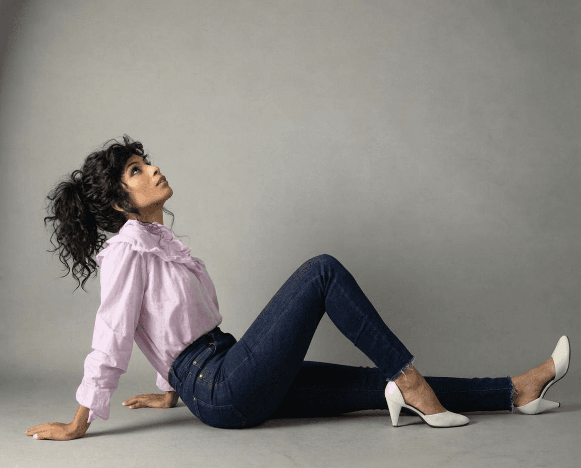 AI generated: Make the young model's jeans, tight fitting and have her hair bunched up in a loose, messy pony tail...