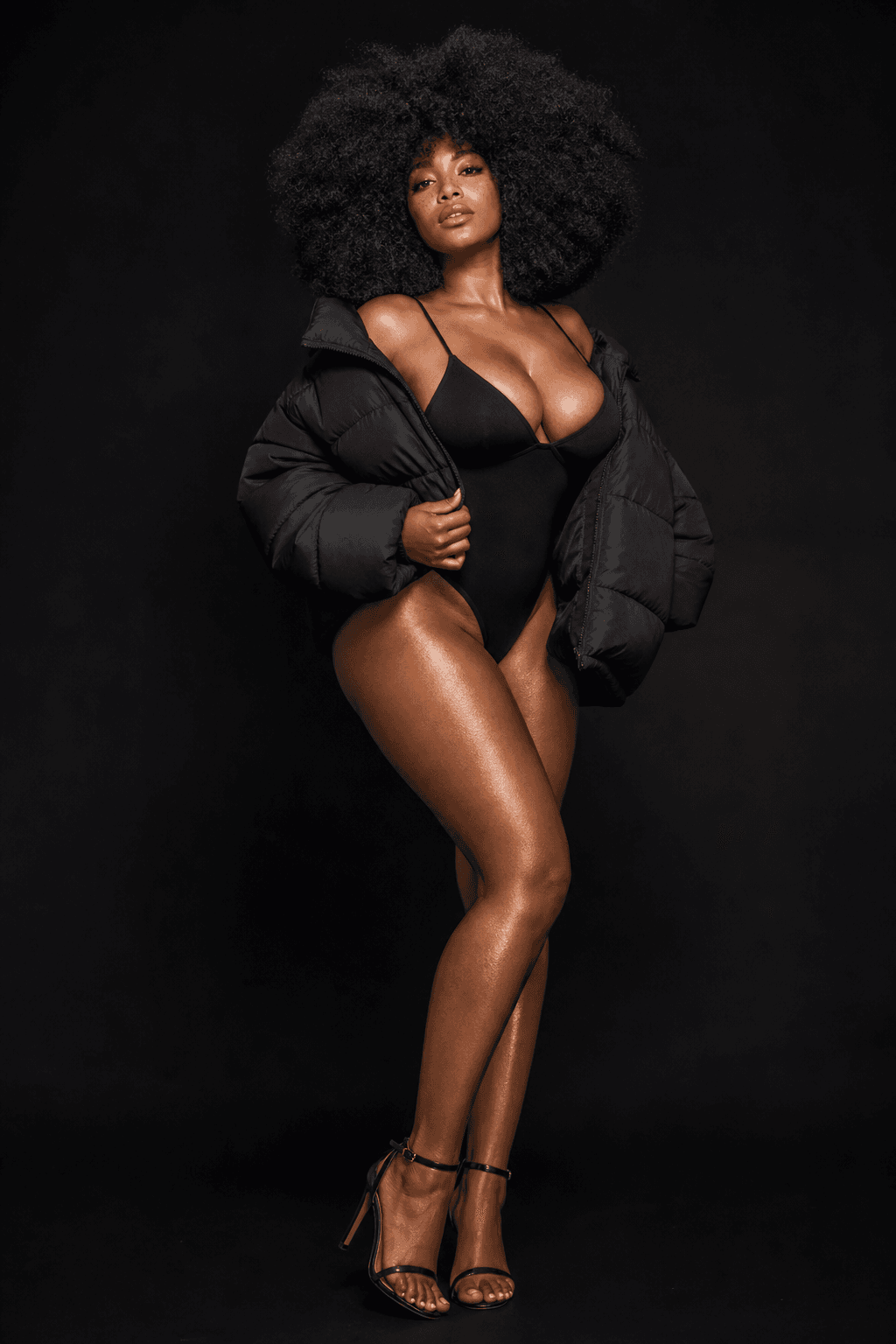 AI generated: exaggerated large glossy black afro, matte black puffer jacket, matte black background, 4k, full bod...