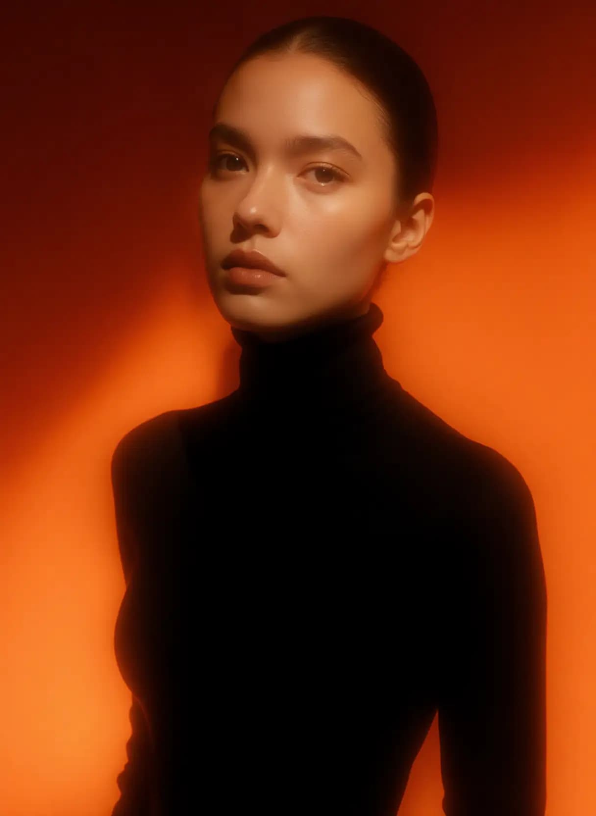 AI generated: A woman stands against a gradient background that transitions from a deep, warm orange at the bottom...