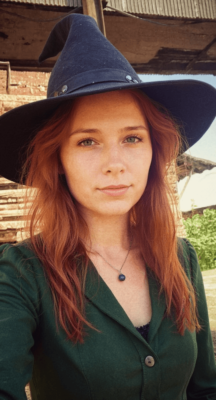 AI generated: young red-haired Witch 