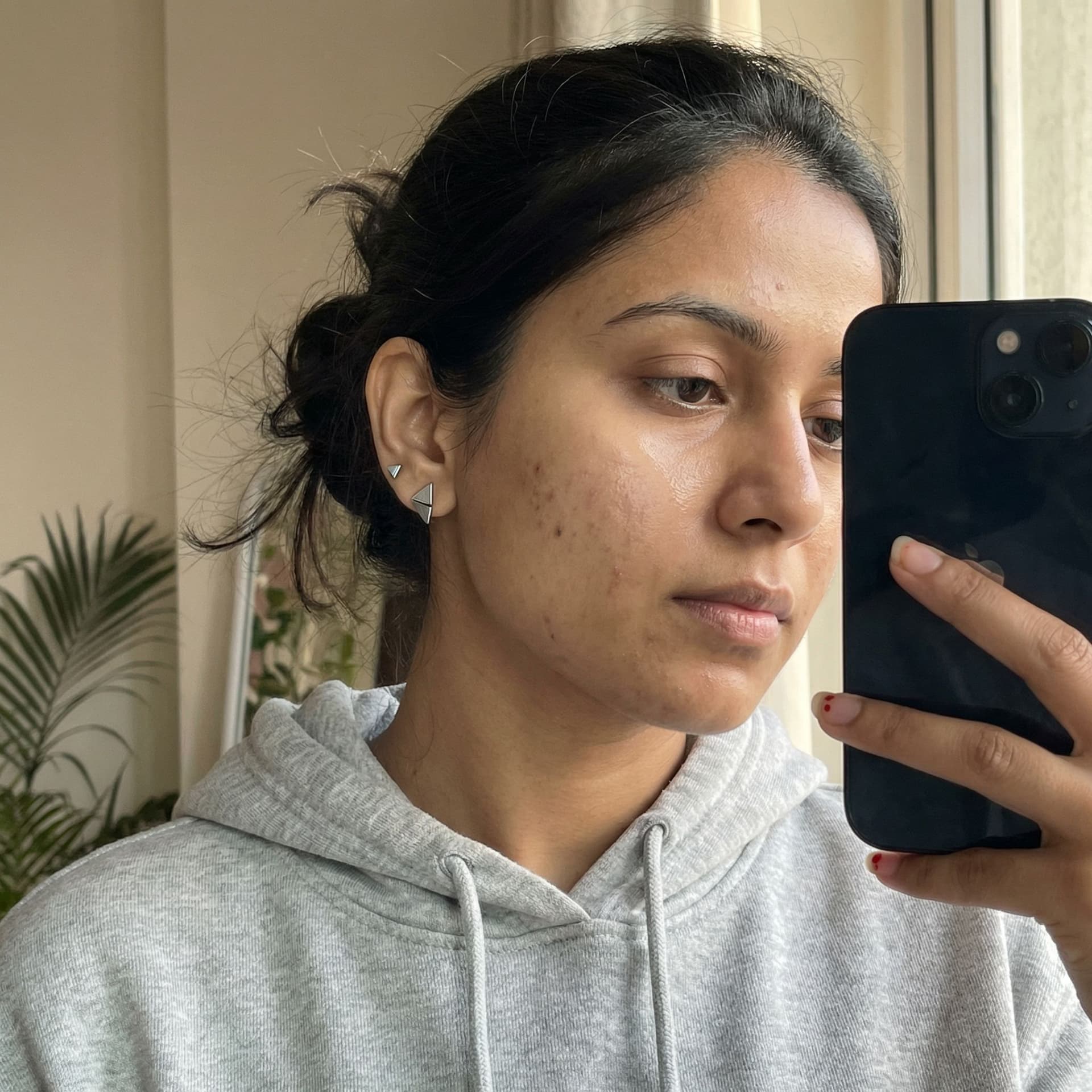 AI generated: 9:16 vertical aspect ratio, ultra-realistic smartphone mirror selfie of a South Asian woman in her l...