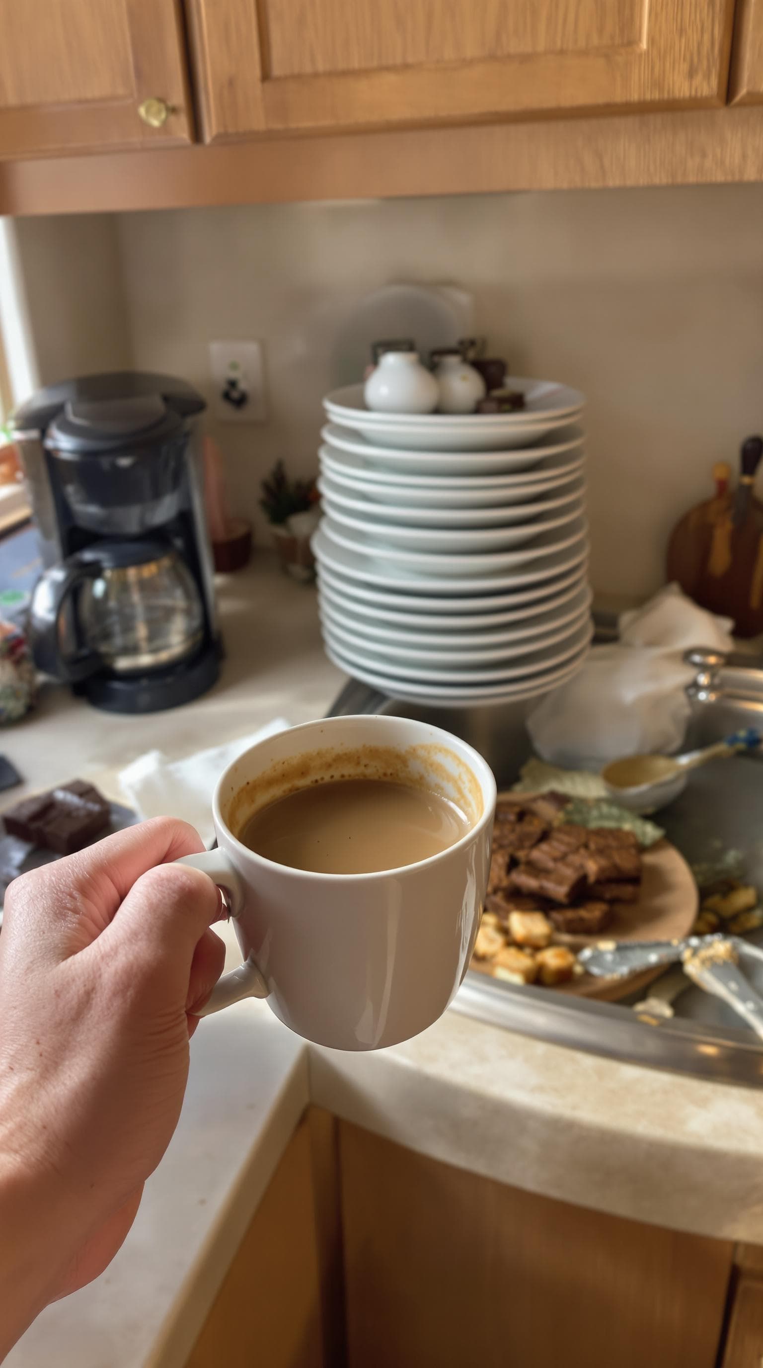 AI generated: POV first-person, I am standing in my kitchen, holding a cup of coffee. Only my hands are visible in...
