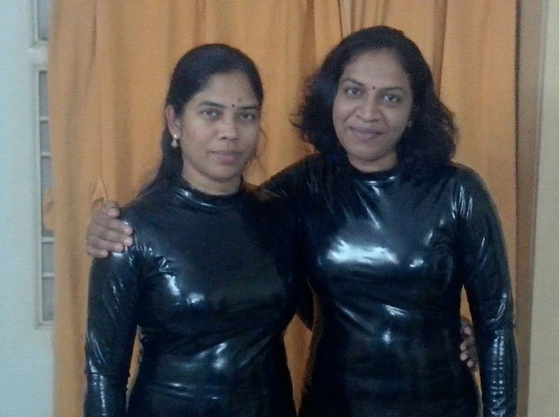 AI generated: make them wear black latex dress