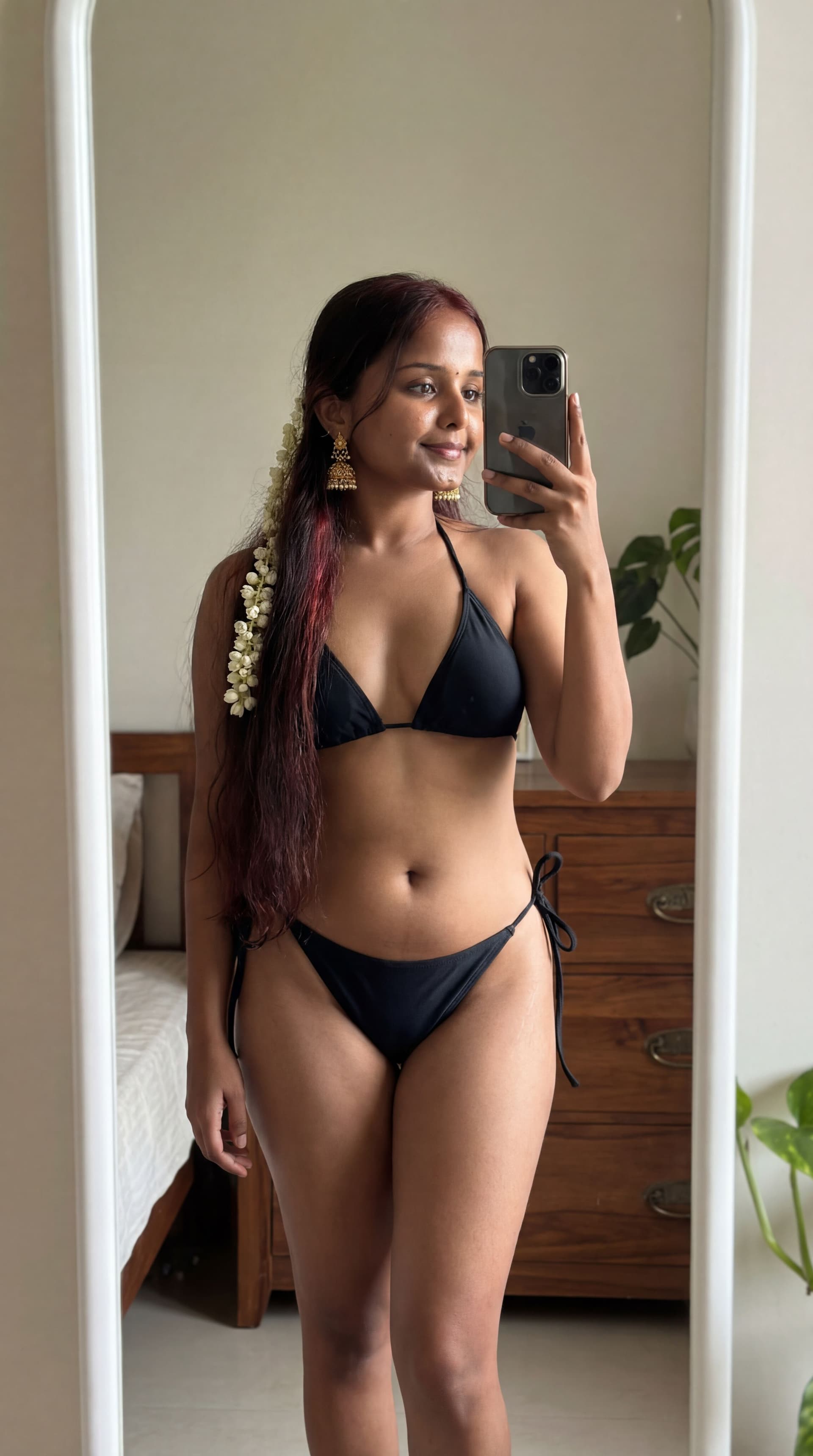 AI generated: very sexy black hair 5ft3 long hair to in a bikini taking a pictuire in the morror 
