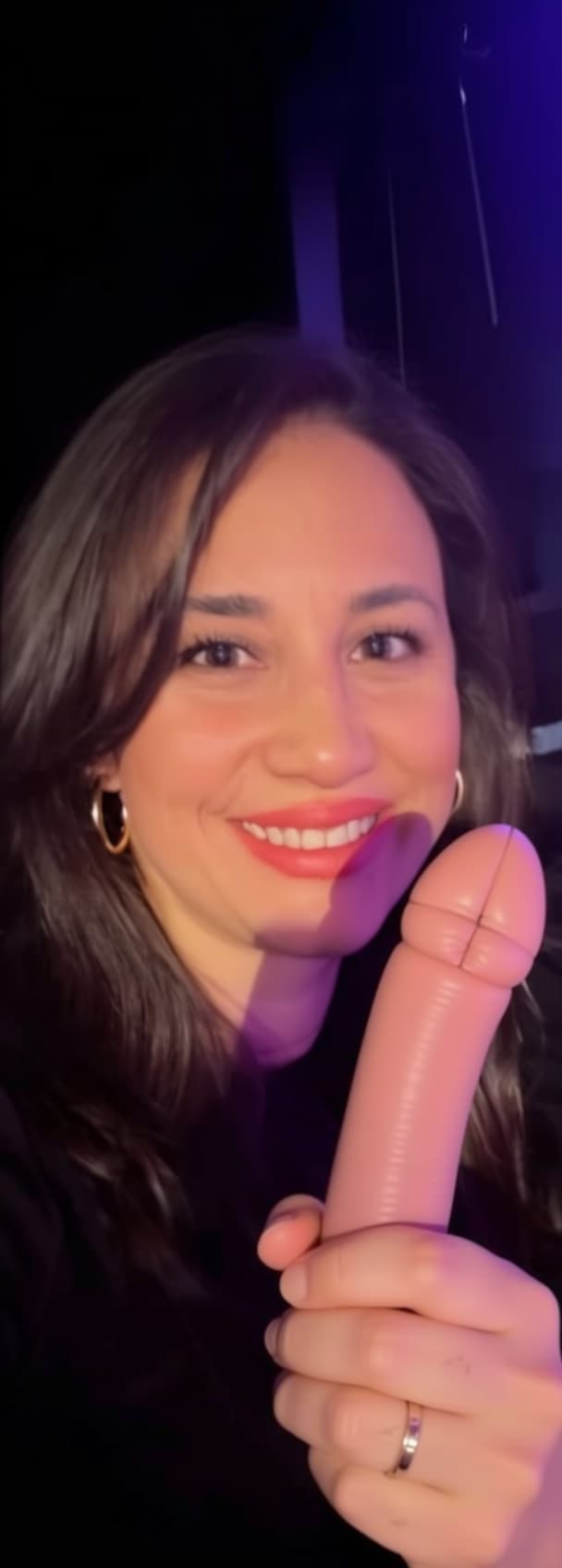 AI generated: holding a  penis in her hand