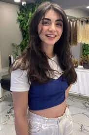 AI generated: Generate an image of a woman with a resemblance to Özge Törer, the Turkish actress. The woman should...