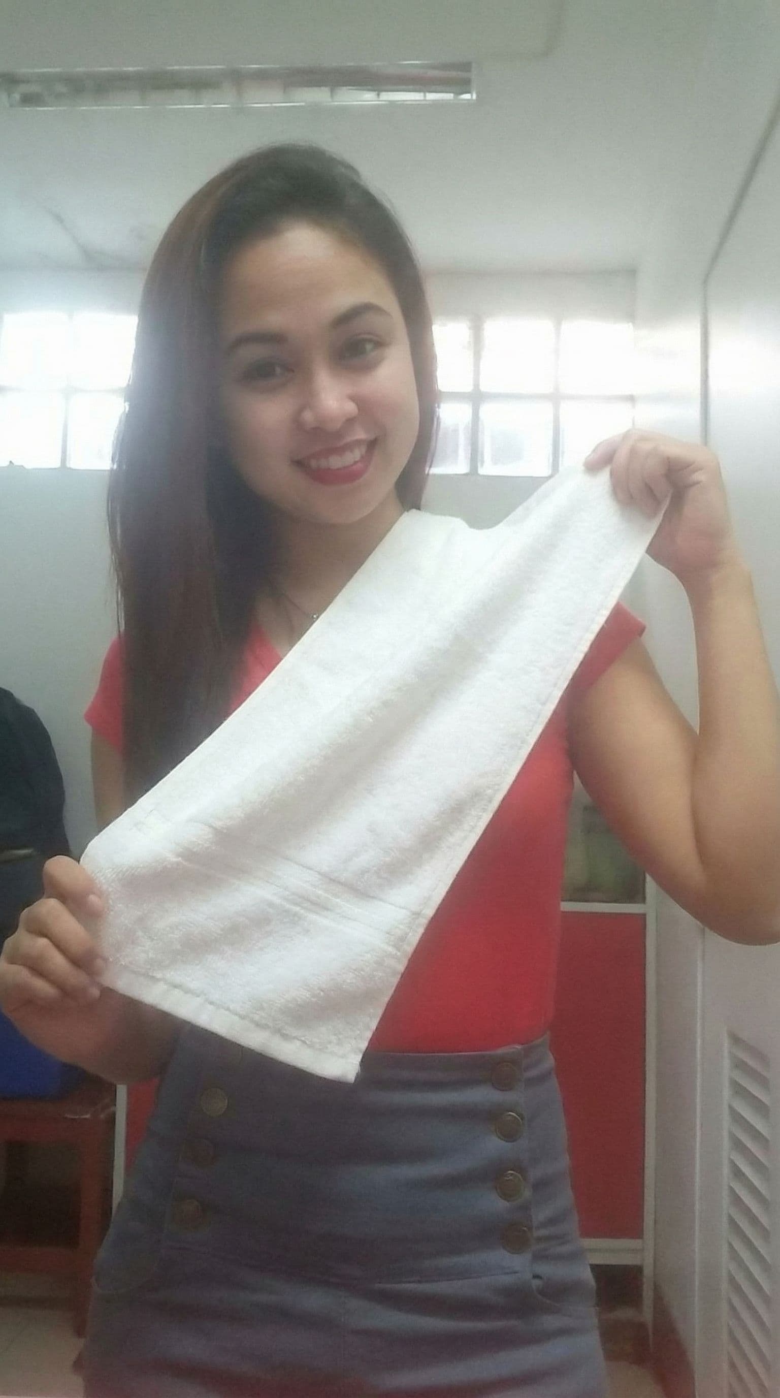 AI generated: create another image of the same model with the towel posing differently
