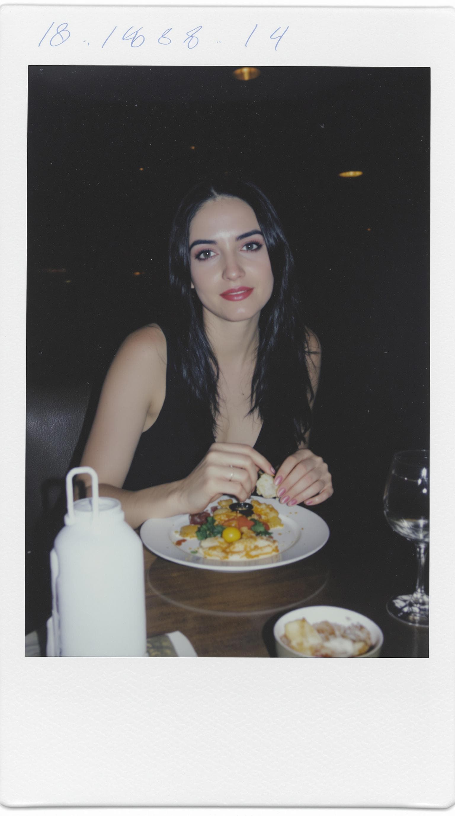 AI generated: 18-year-old woman, black hair, light blue eyes, tanned white skin, thin body, and light makeup. She'...