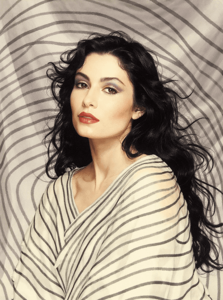AI generated: An image of  a woman with flowing black hair and fair skin. She has a serene expression and is gazin...