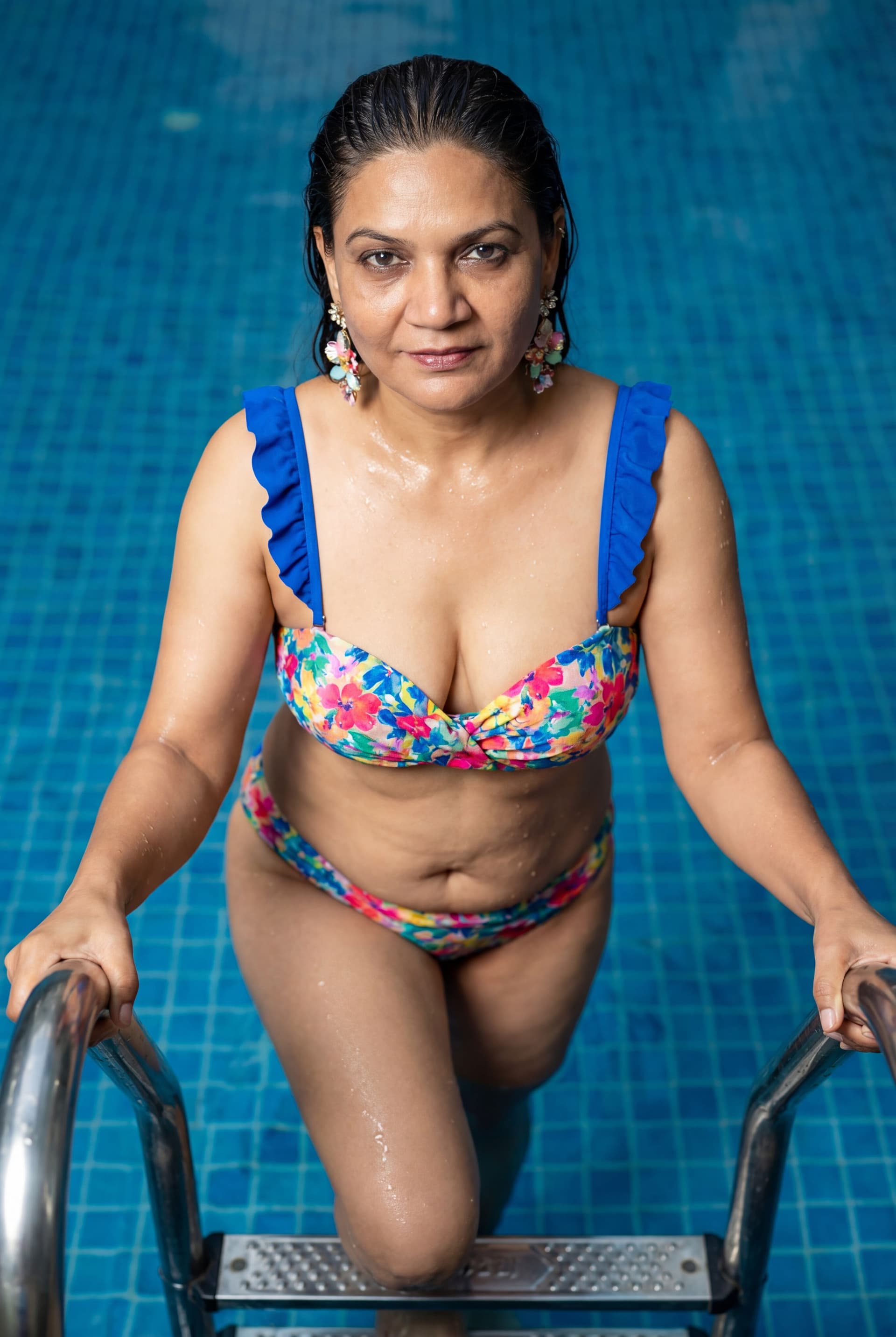 AI generated: { "image_type": "photograph", "genre": "fashion_swimwear_editorial", "composition": { "framing": "me...