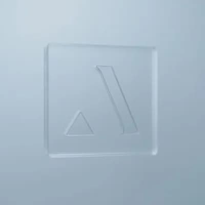 AI generated video: A minimalist scene with a soft light blue background. In the center, a translucent rectangular plate...