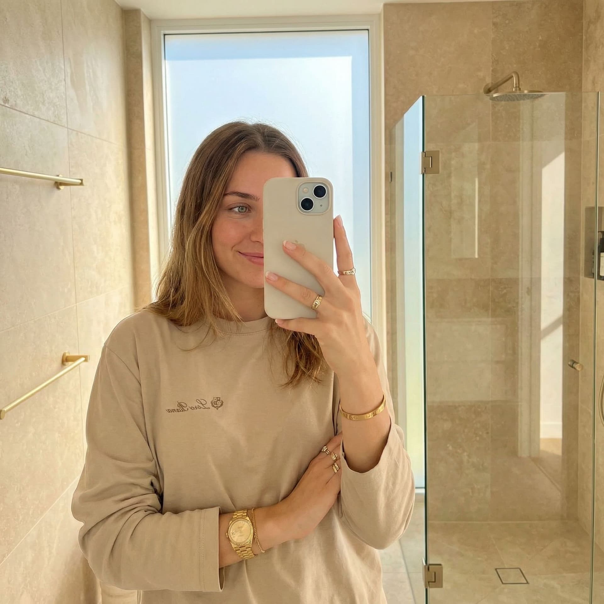 AI generated: Create an ultra-photorealistic horizontal (landscape) mirror selfie of a young adult woman (mid-20s)...