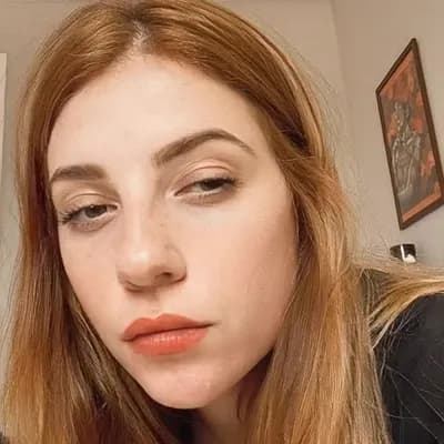 AI generated video: she  removes her clothesis completely topless naked and reveals her big saggy breasts tits. 