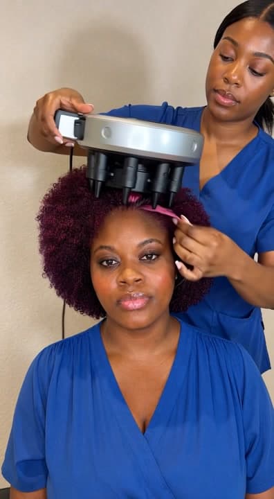 AI generated video: Using a very big automation braiding round machine on my client who have pink and wine colour hair f...