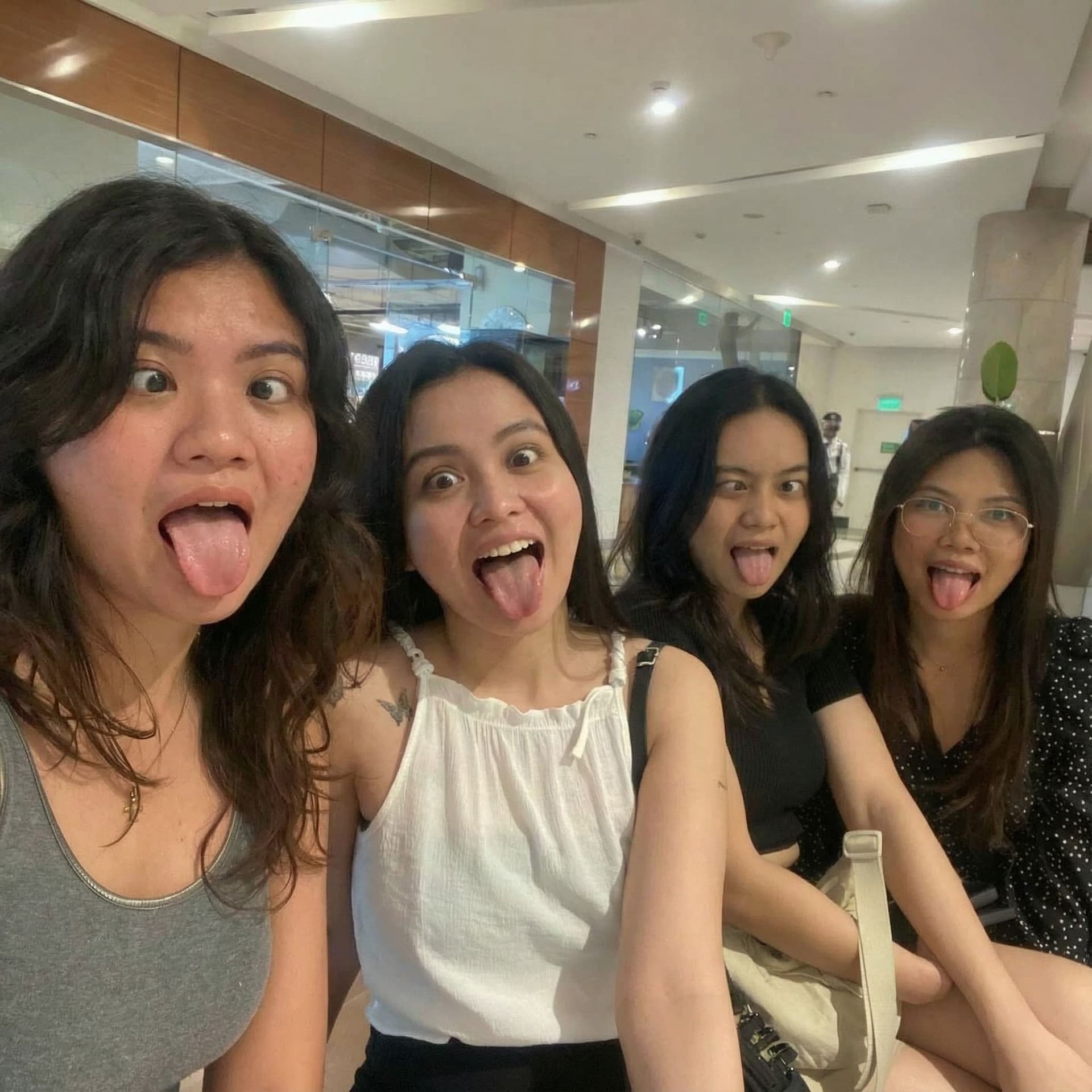 AI generated: Generate a photo of all four of us girls sticking our tongue out our mouths are wide open so you can...