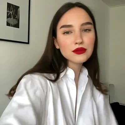AI generated video: she  removes her clothes instantly and is completely topless naked and reveals her big saggy breasts...