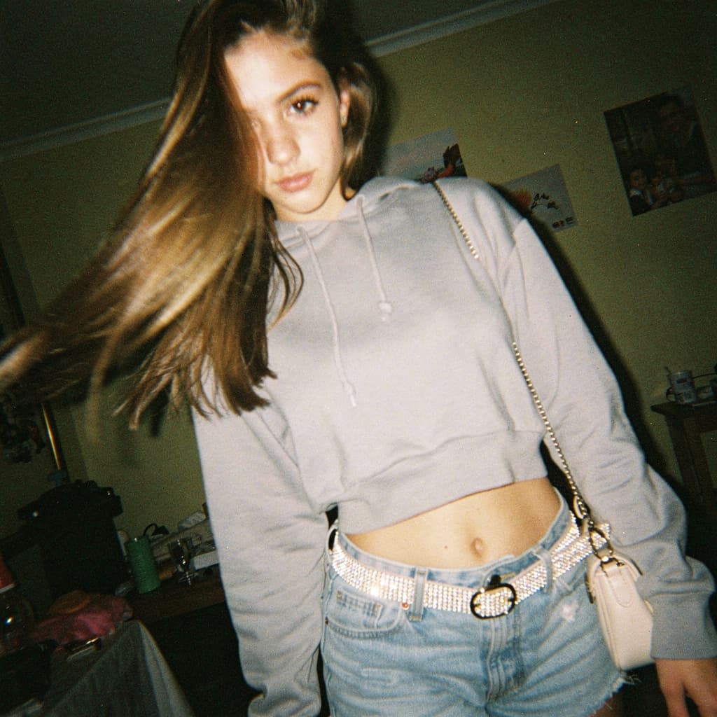 AI generated: a lo-fi 2015s-era, diagonally taken, low-quality iPhone photo of a 20-year-old baddie. The shot is i...