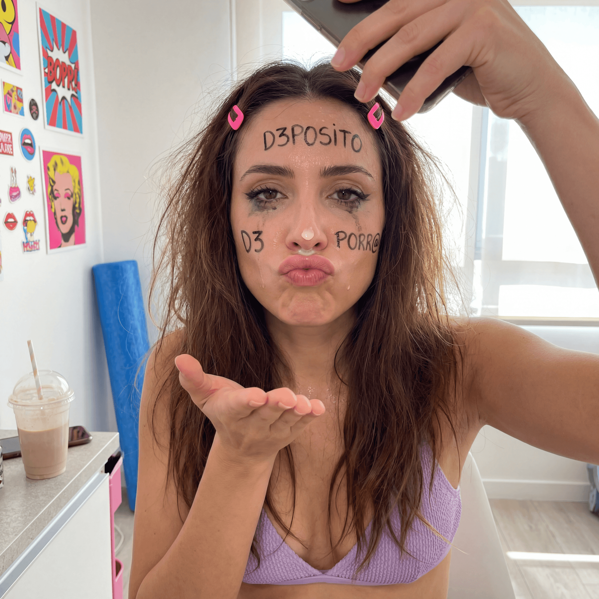 AI generated: Vertical 9:16 photorealistic selfie of an adult woman, in a bright room, camera held slightly above ...