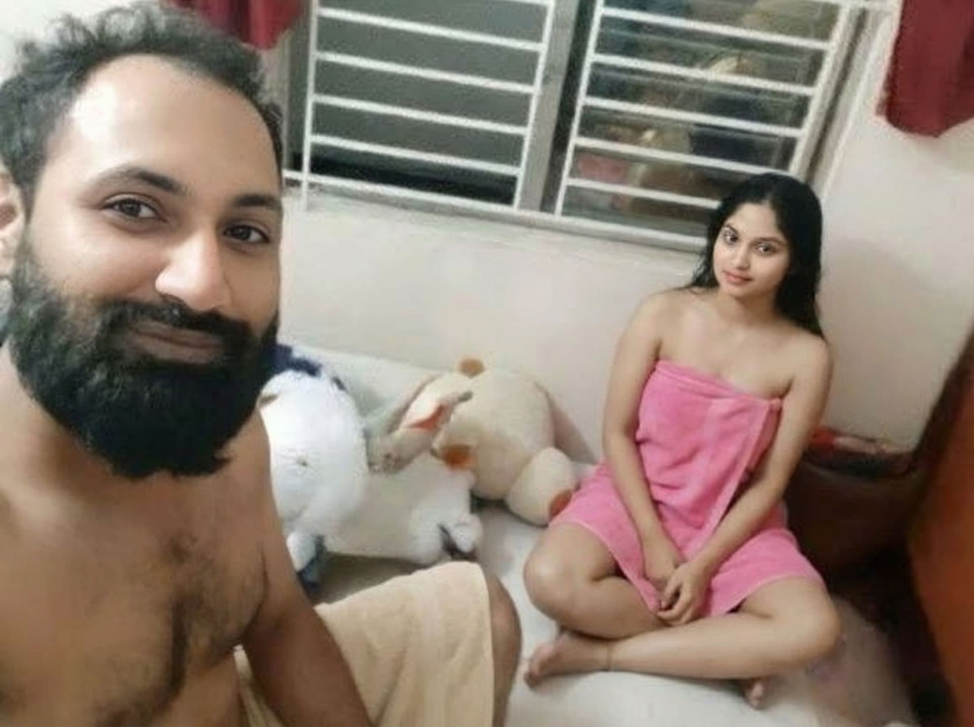 AI generated: Boy in nude and girl wearing pink short towel 