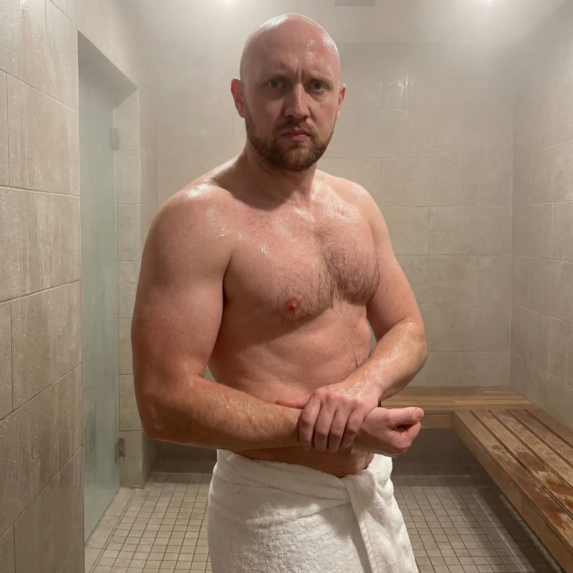 AI generated: A realistic image of a 35-year-old male bodybuilder model, wearing a towel around his waist, posing ...