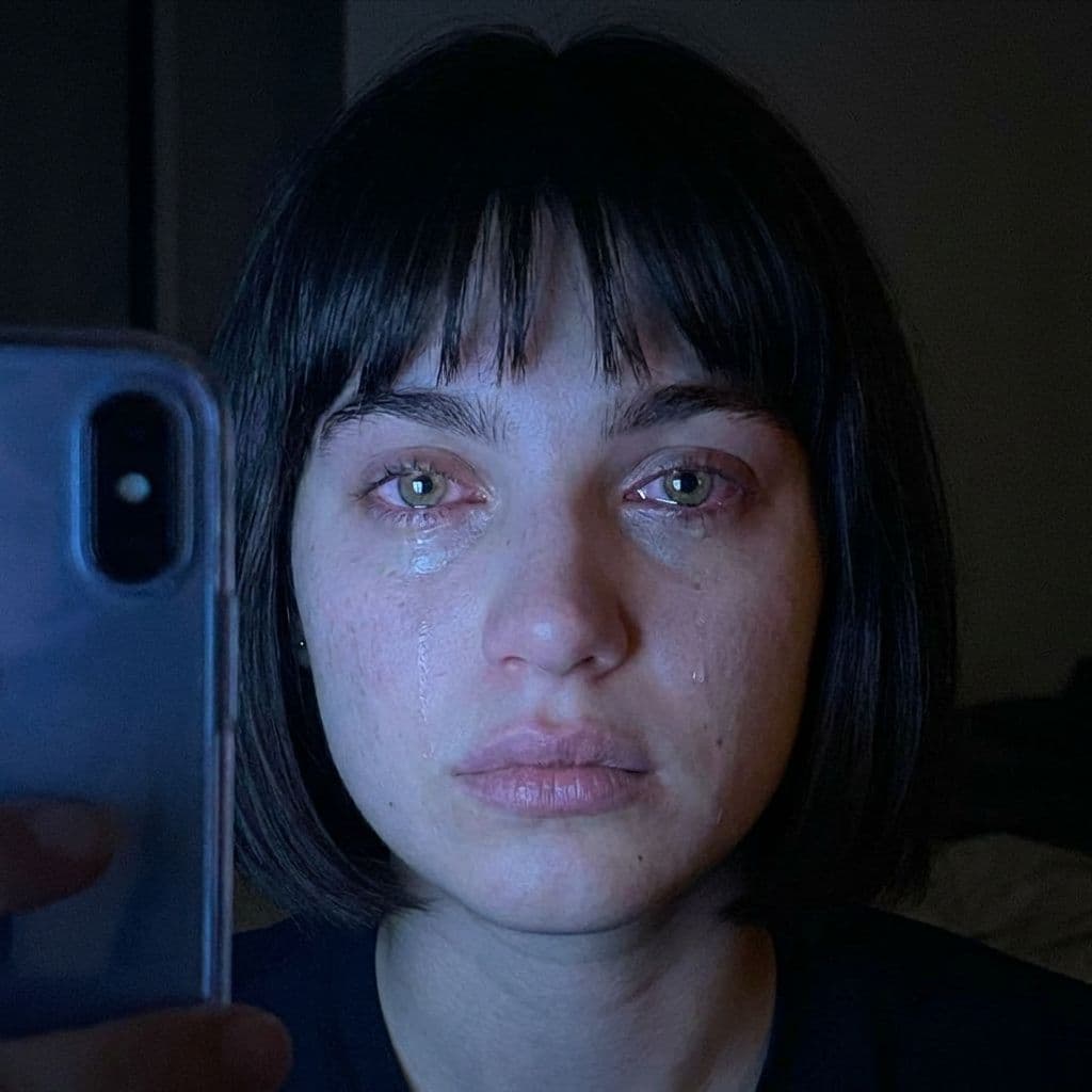 AI generated: A realistic close-up selfie shot of the same young woman from the reference image, captured front-fa...